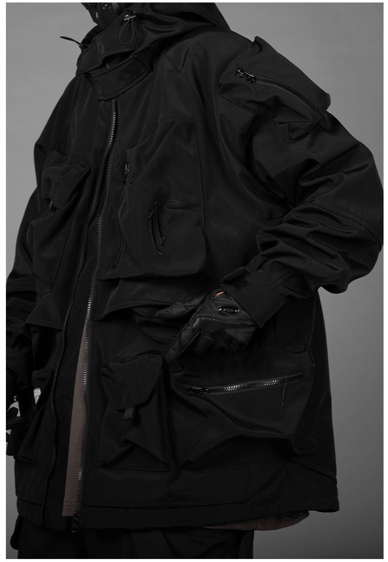Man With Hooded Tooling And Three-dimensional Multi-pocket Jacket