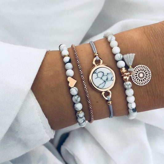 Pulsera de cuatro piezas geométrica creativa con flecos de piedra de pino