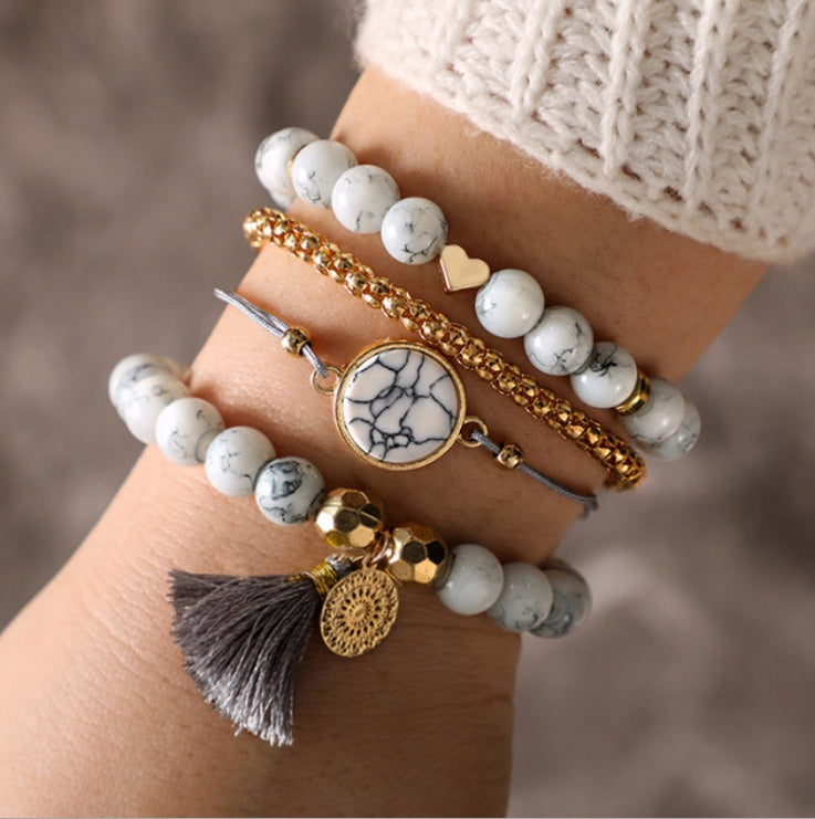 Pulsera de cuatro piezas geométrica creativa con flecos de piedra de pino