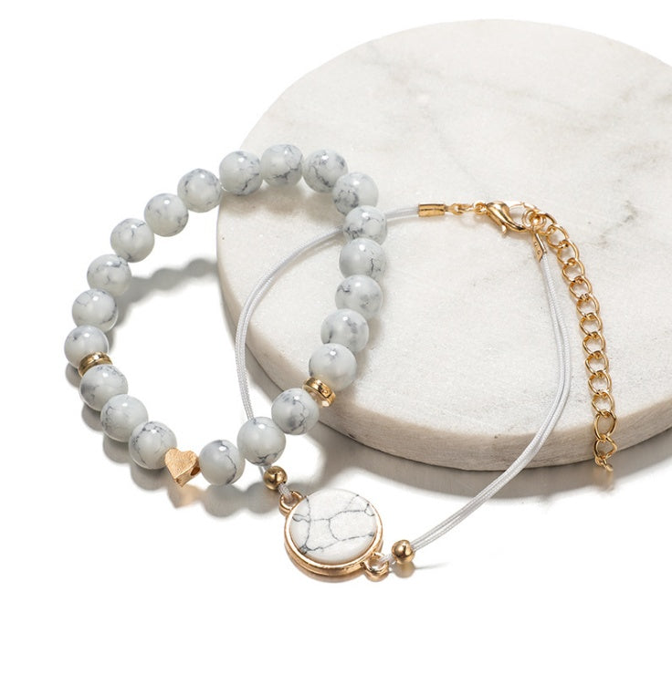 Pulsera de cuatro piezas geométrica creativa con flecos de piedra de pino