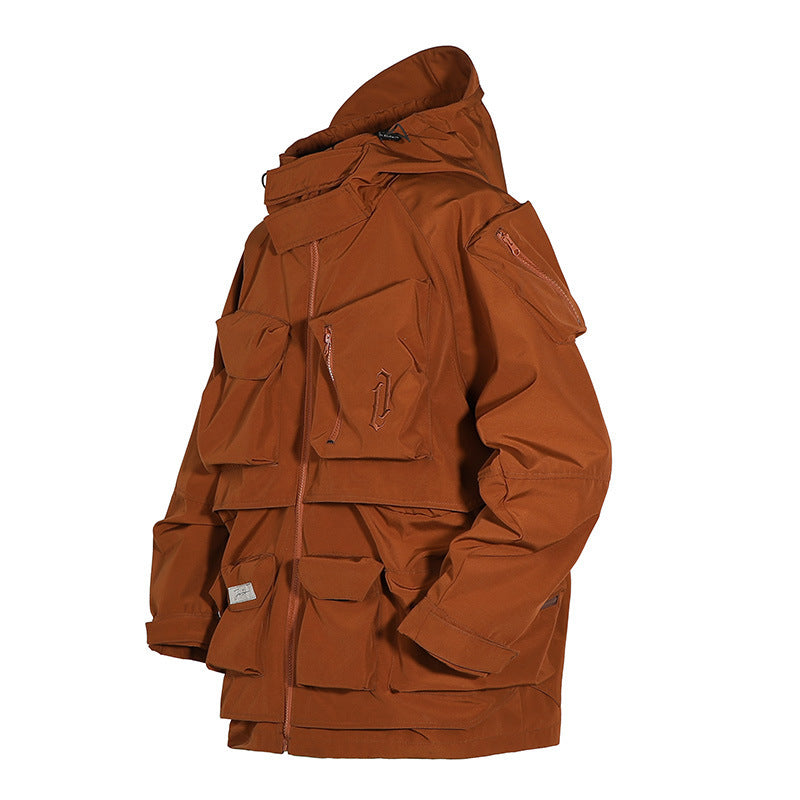 Man With Hooded Tooling And Three-dimensional Multi-pocket Jacket